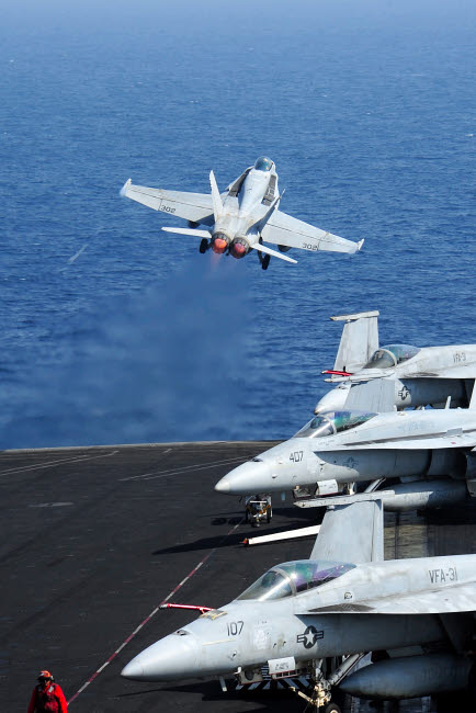 F/A-18C Hornet taking off from USS George HW Bush poster print