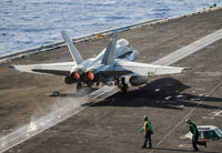 US Navy F/A-18C Hornet launching from USS Nimitz poster print.