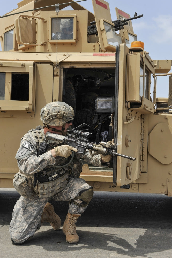 U.S. Army soldier communicating inside a Humvee poster print.
