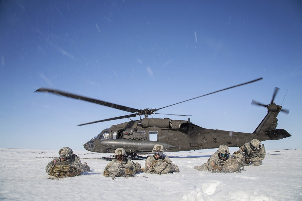 U.S. Army paratroopers exiting UH-60 Black Hawk helicopter during Arctic Pegasus exercise