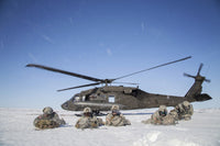 U.S. Army paratroopers exiting UH-60 Black Hawk helicopter during Arctic Pegasus exercise