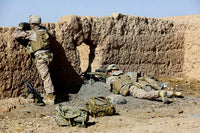 US Marines Taking Cover During Patrol in Afghanistan Poster Print