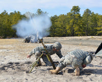 US Army National Guardsmen firing a 60mm mortar round poster print.