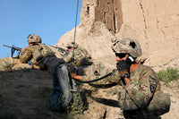 US Army Specialist conducting a radio check in Afghanistan poster print.