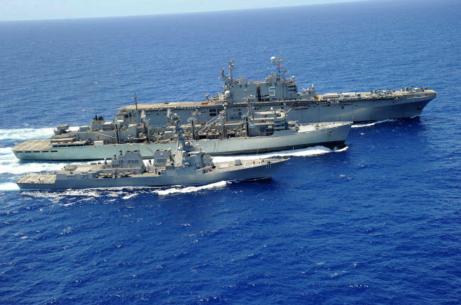 USS Peleliu and USS Spruance replenishment at sea poster print
