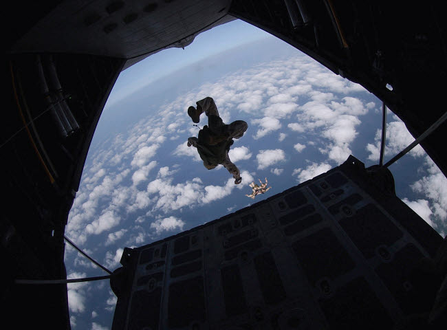 Airmen jumping from HC-130 Hercules aircraft over Djibouti.