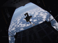 Airmen jumping from HC-130 Hercules aircraft over Djibouti.