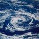 Circular Clouds Poster Print showcasing stunning aerial cloud formations.