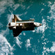 Space Shuttle in Space Poster Print showcasing the shuttle in the cosmos.
