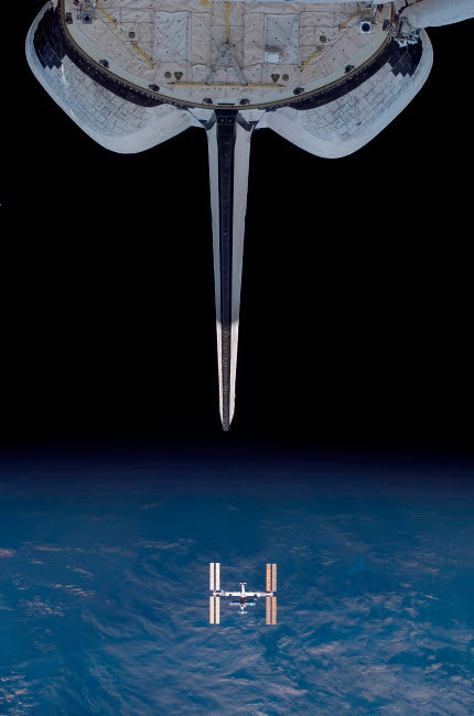 Space Shuttle Endeavour departing from the International Space Station poster print.