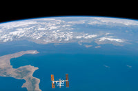 International Space Station Poster Print by Stocktrek Images showcasing Earth from space.