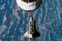 Space Shuttle Atlantis approaching the International Space Station poster print.
