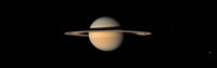 Saturn Poster Print by Stocktrek Images showcasing the planet's rings and colors.