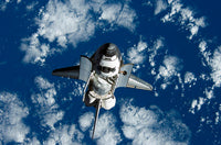 Space Shuttle Discovery Poster Print showcasing the iconic shuttle.