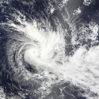 Tropical Cyclone Daman Poster Print featuring a cyclone over the South Pacific Ocean.