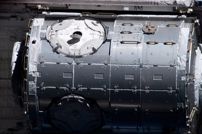 The Harmony Node in the payload bay of Space Shuttle Discovery poster print.