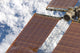 Close-up view of a repaired solar array on the International Space Station poster print