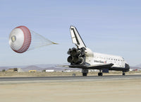 Space Shuttle Endeavour with drag chute deployed poster print.