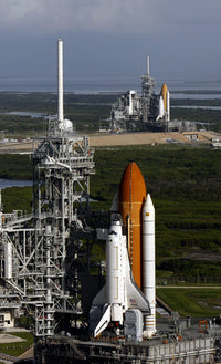Space Shuttle Atlantis and Endeavour on launch pads at Kennedy Space Center poster print.