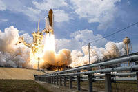 Space Shuttle Atlantis launching from the launch pad poster print