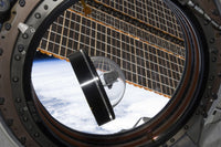 A Moon Rock Floats Aboard the International Space Station Poster Print