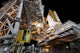 Technicians rolling the rotating service structure of Space Shuttle Discovery poster print.