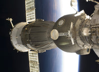 Soyuz spacecraft poster print with Earth backdrop.