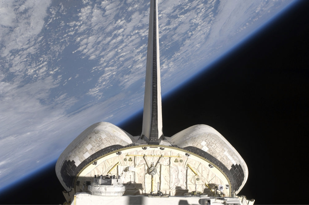 Space Shuttle Endeavour partial view poster print against Earth's horizon.