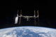 International Space Station and Space Shuttle Discovery poster print, showcasing Earth and space.