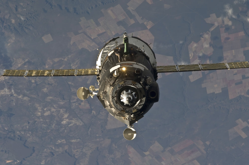 Soyuz TMA-19 spacecraft relocation poster print featuring International Space Station.