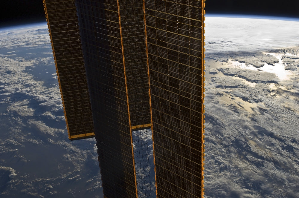 International Space Station Solar Array Poster Print showcasing Earth and space.