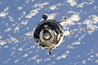 Poster print of Soyuz TMA-01M spacecraft approaching the International Space Station on October 9, 2010.