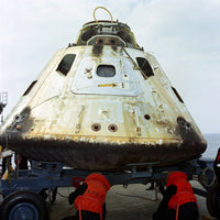 Close-up view of the Apollo 9 Command Module on the deck of the USS Guadalcanal.