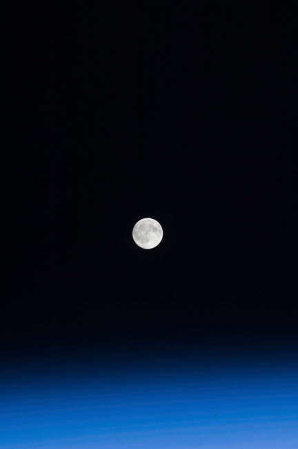 The Moon and Earth's atmosphere poster print showcasing celestial beauty.