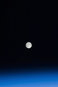 The Moon and Earth's atmosphere poster print showcasing celestial beauty.