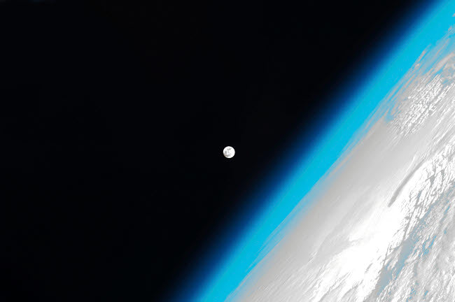 The Moon and Earth's Atmosphere Poster Print by Stocktrek Images