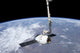 SpaceX Dragon cargo craft grappled by Canadarm2 at International Space Station poster print