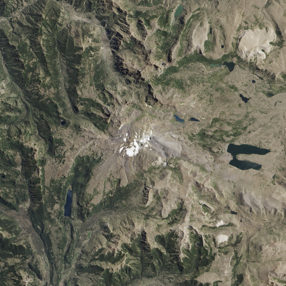 Satellite view of Copahue Volcano with glacier and acidic lake.