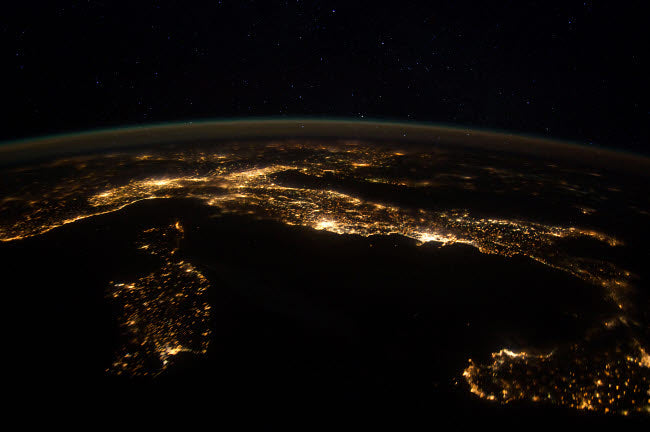 Nighttime panorama showing city lights of Europe poster print.