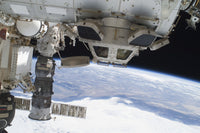 Components of the International Space Station above the Pacific Ocean Poster Print