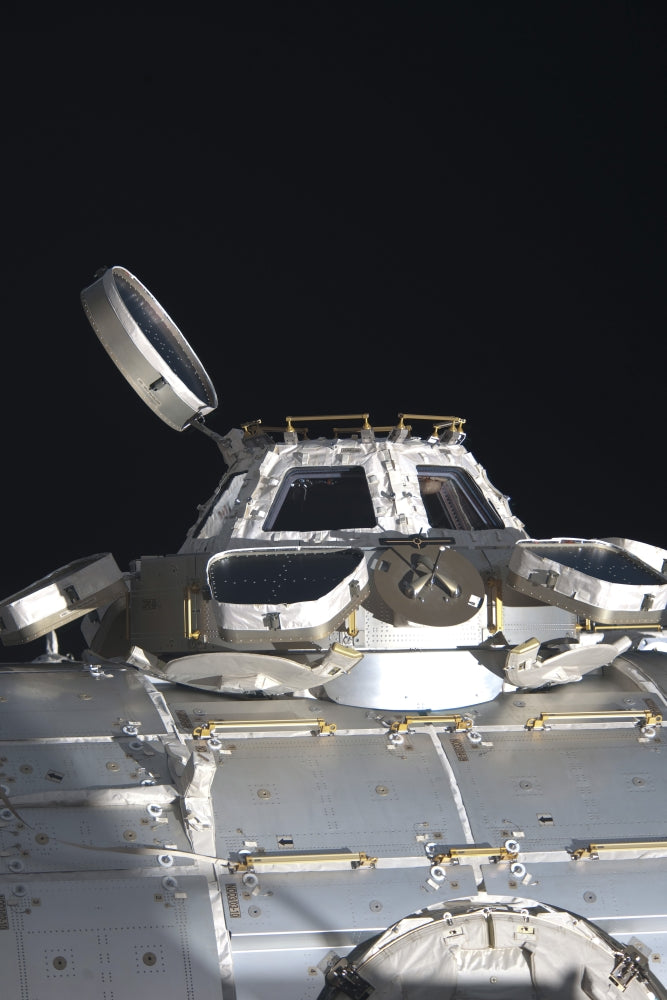 Cupola of the International Space Station poster print against the backdrop of space.