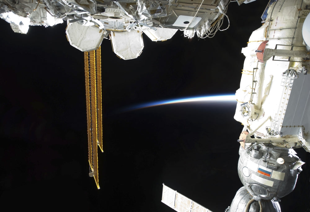 Poster print of a docked Russian Soyuz spacecraft and International Space Station.