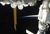 Poster print of a docked Russian Soyuz spacecraft and International Space Station.