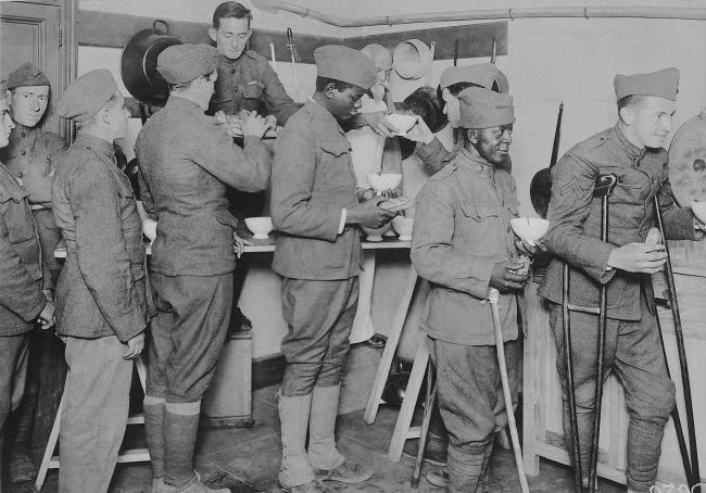 American soldiers receiving food at the Red Cross canteen poster print by Stocktrek Images