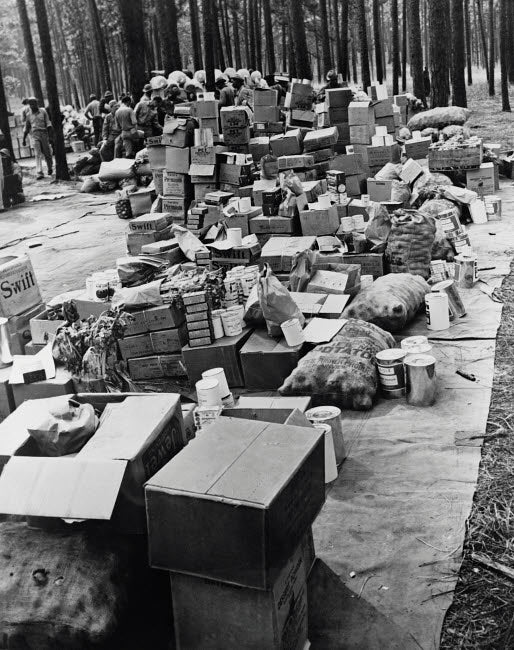 Rations being loaded into trucks during Louisiana Maneuvers circa 1942 poster print
