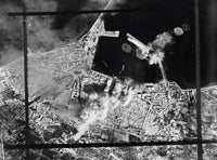 Aerial photograph of bombing hits on a pierhead in Sousse, Tunisia, circa 1943.