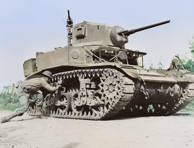 World War II soldier placing TNT charge on light tank poster print.