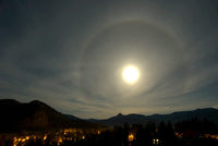 Harvest Moon Halo Poster Print by Yuichi Takasaka showcasing a lunar phenomenon in Lumby, British Columbia.