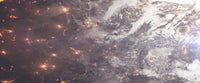 Aerial view poster of a planet being ripped apart by lava