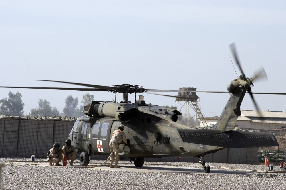 UH-60 Blackhawk Medivac helicopter refueling at Camp Warhorse poster print.